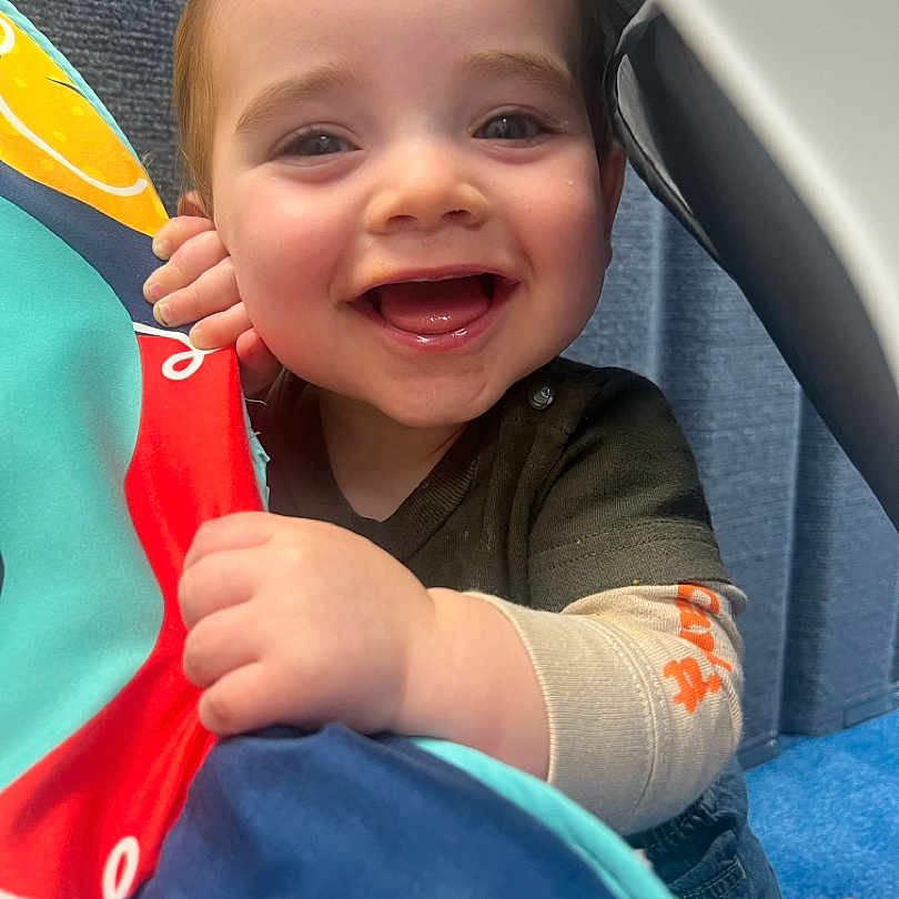 Kizer joined the competition — help win amazing prizes! baby, babylaughing, bodypart, clothing, coat, cricket, cricketbat, face, finger, hand, happy, head, jacket, laughing, pants, person, photography, portrait, smile, sport