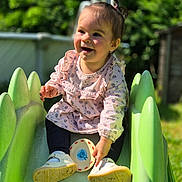 Ivanna participe au concours pour gagner de l'argent avec cette photo : toddler, child, slide, outdoor, playground, smiling, toy, sunlight, green, grass, happy, clothing, shoes, face, person, nature, daytime, garden, cute, play