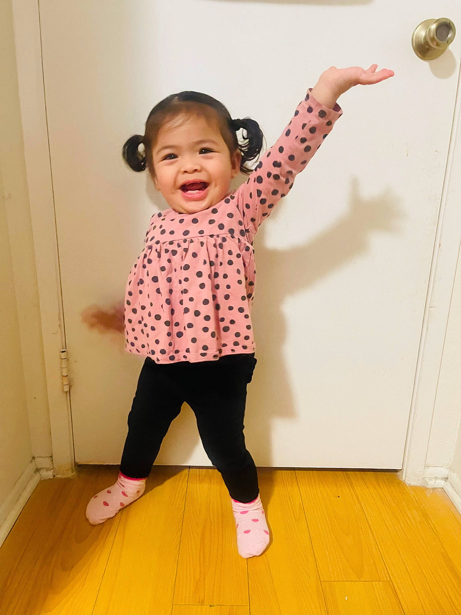Eleanor joined the competition — help win amazing prizes! baby, baby_toddler_clothing, face, flooring, fun, gesture, happy, hardwood, joint, joy, magenta, pattern, person, pink, product, sleeve, smile, standing, t_shirt, toddler