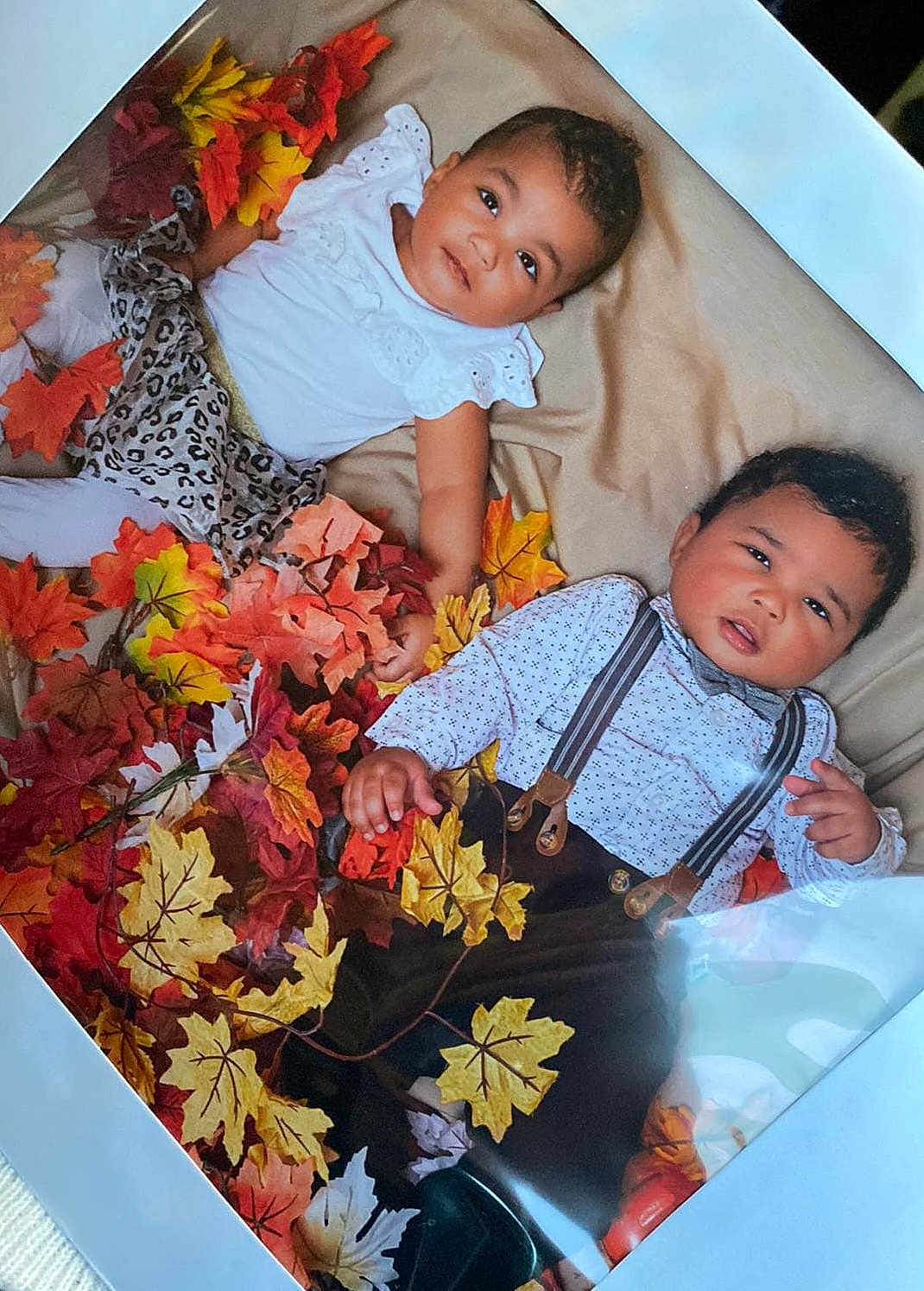 Koa joined the competition — help win amazing prizes! baby, infant, child, autumn_leaves, fall, blanket, cute, portrait, fashion, clothing, suspenders, bow_tie, leopard_print, white_top, patterned_shirt, indoor, laying_down, two_children, diversity, seasonal