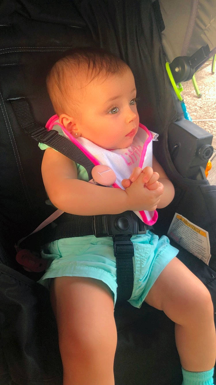 Ilyana joined the competition — help win amazing prizes! baby, baby_carriage, baby_toddler_clothing, cheek, comfort, face, finger, flash_photography, head, human_leg, joint, lap, leg, mouth, person, pink, skin, thigh, thumb, toddler