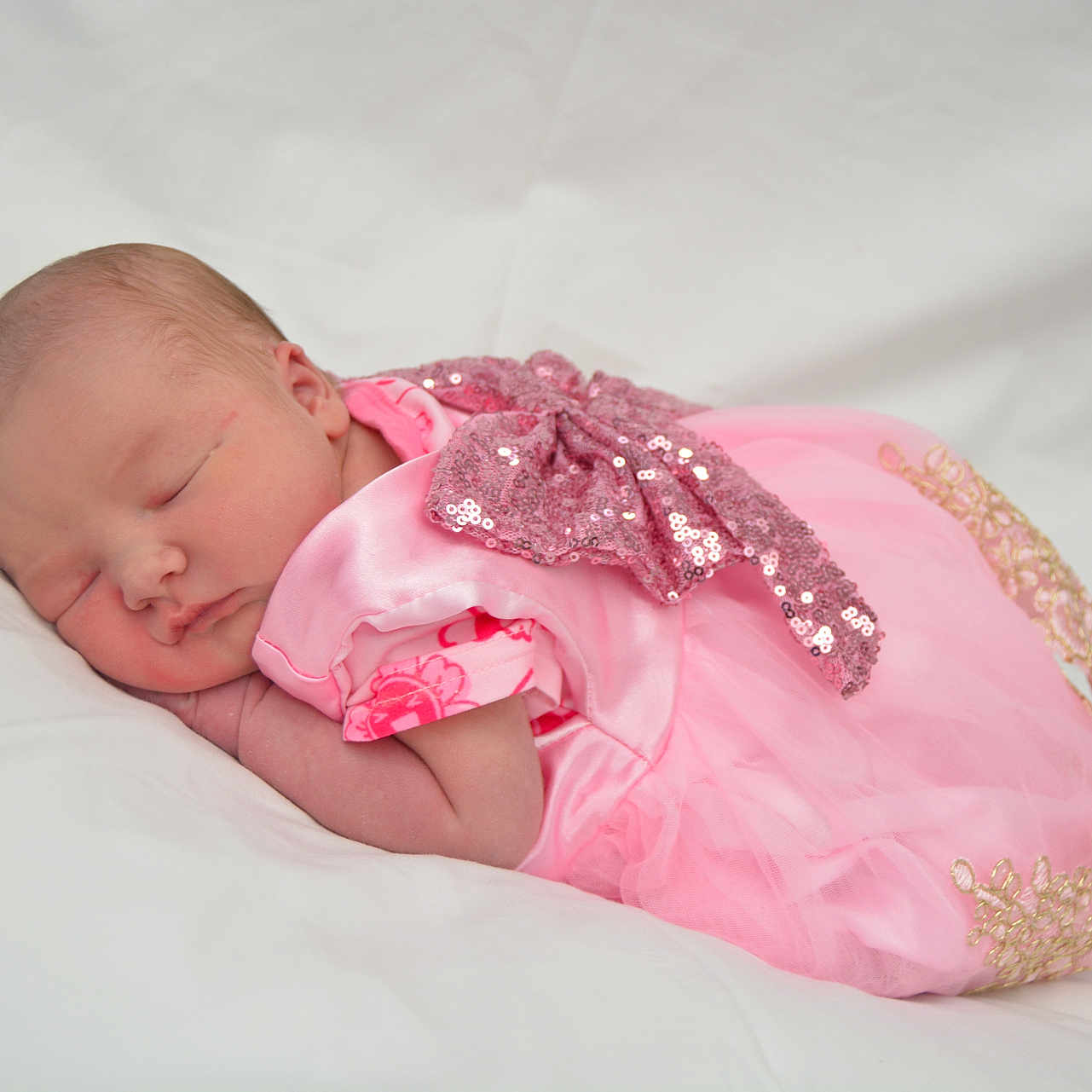 Violett is registered to the contest to win money with this photo: adorable, baby, blanket, bow, calm, child, cute, face, infant, newborn, peaceful, pink_dress, portrait, rest, skin, sleep, sleeping, soft, tulle, young