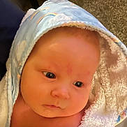 Jace joined the competition — help win amazing prizes! baby, towel, hood, face, skin, infant, blue, rainbow, cloud, soft, cute, child, newborn, wrapped, portrait, indoors, expression, person, closeup, blanket