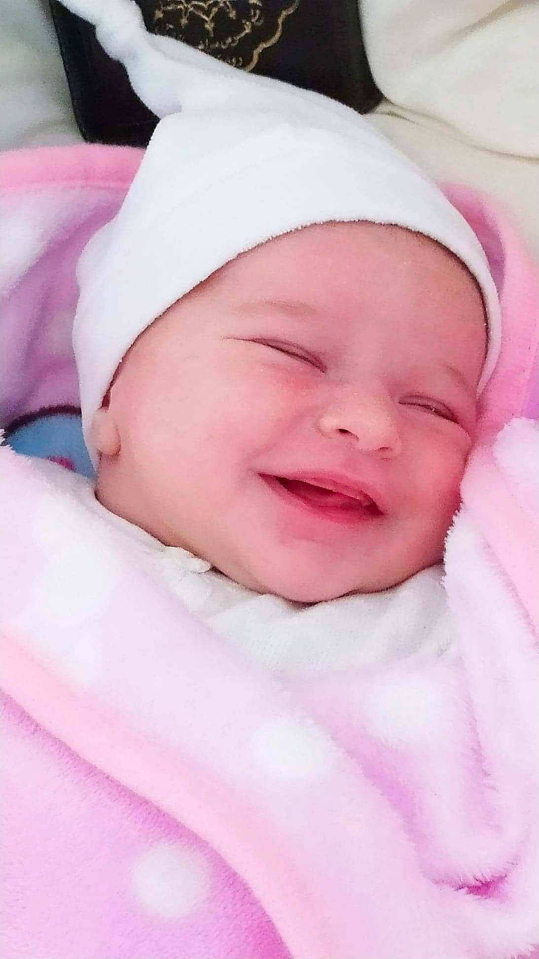 Elyna a rejoint le concours — aidez-le/la à gagner de superbes lots ! baby, baby_making_funny_faces, baby_sleeping, bedtime, cheek, child, face, head, headgear, headwear, joy, lip, mouth, nose, person, pink, skin, sleep, smile, toddler