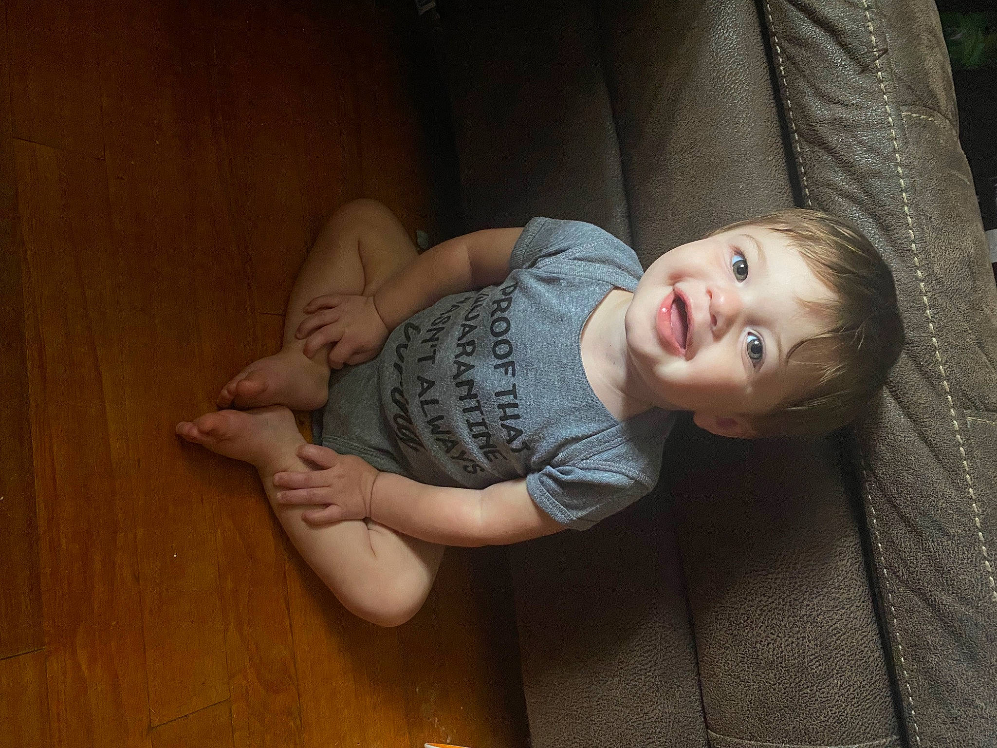 Kolton is registered to the contest to win money with this photo: brown_hair, child, comfort, elbow, flash_photography, floor, flooring, foot, happy, hardwood, human_leg, knee, leg, long_hair, person, sitting, skin, smile, thigh, toddler