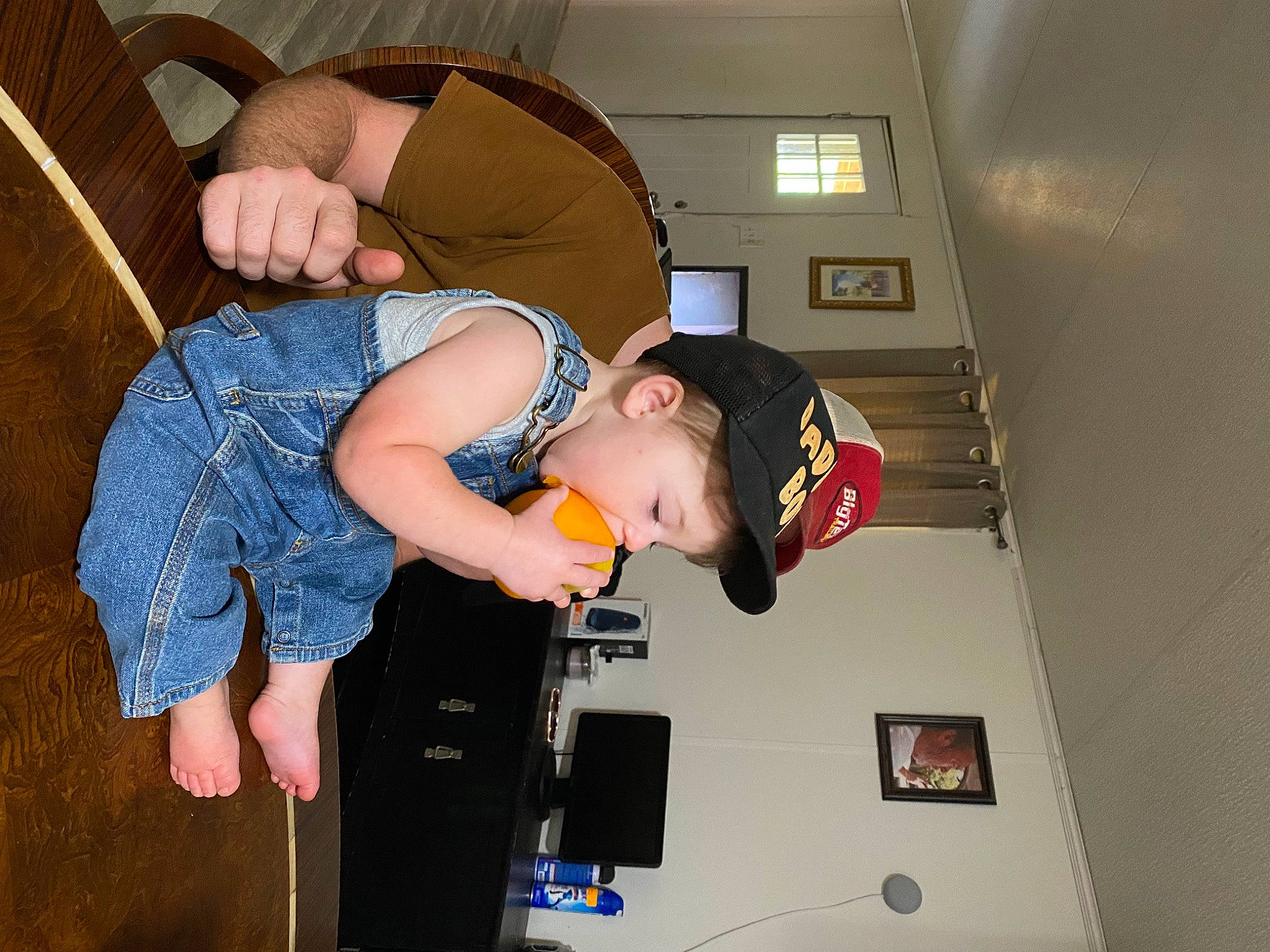 Kolton is registered to the contest to win money with this photo: baby, child, comfort, elbow, fun, hat, joint, knee, person, room, shoulder, t_shirt, toddler, wrist