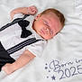 baby, sleeping, infant, blanket, tuxedo, bow_tie, white, black, cute, face, arm, clothing, soft, newborn, portrait, peaceful, indoors, child, resting, bed