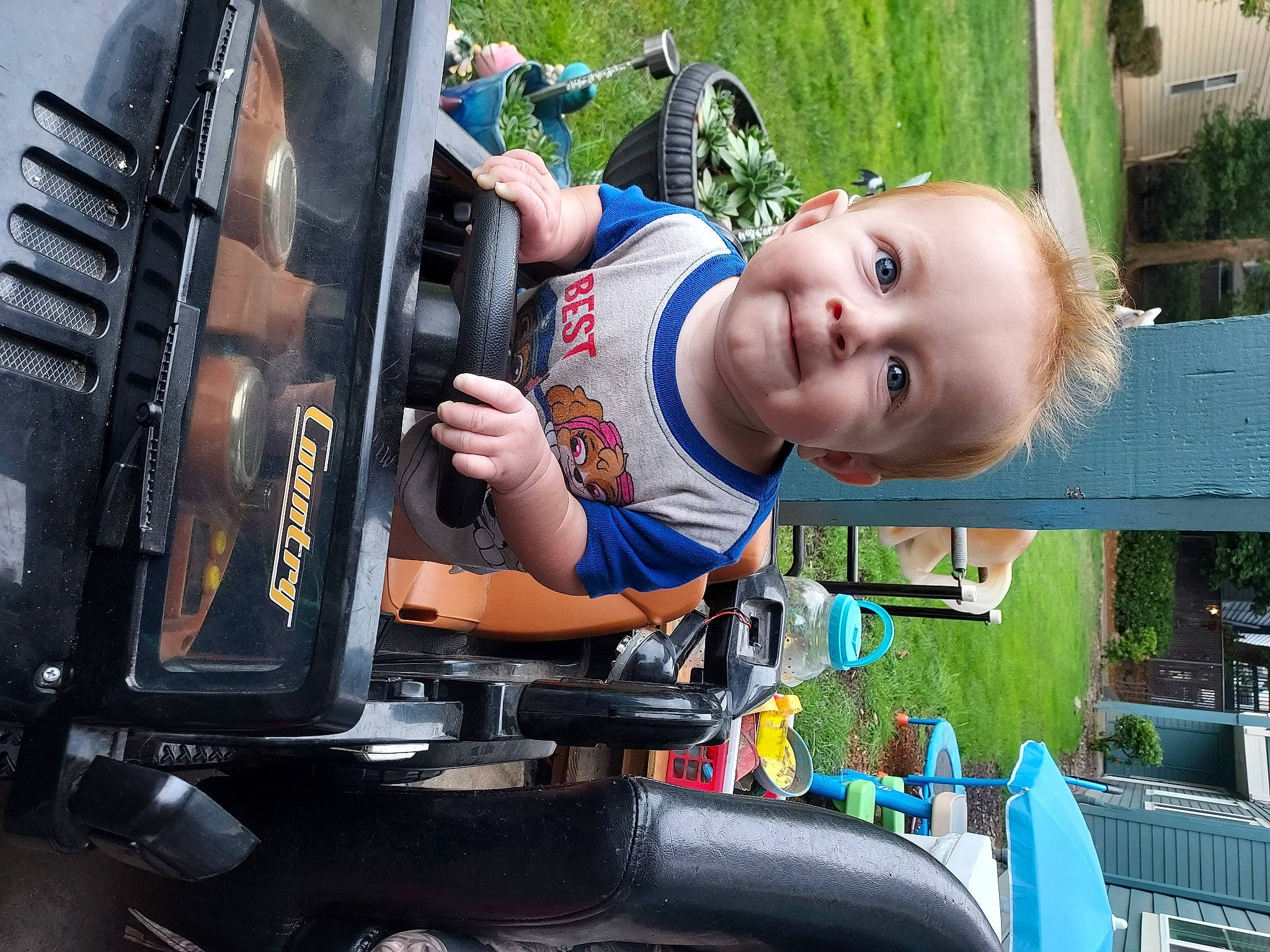 Kannon is registered to the contest to win money with this photo: auto_part, automotive_exterior, automotive_tire, baby, bumper, electric_blue, engineering, fun, grass, happy, joy, leisure, machine, motor_vehicle, people, person, plant, recreation, smile, t_shirt