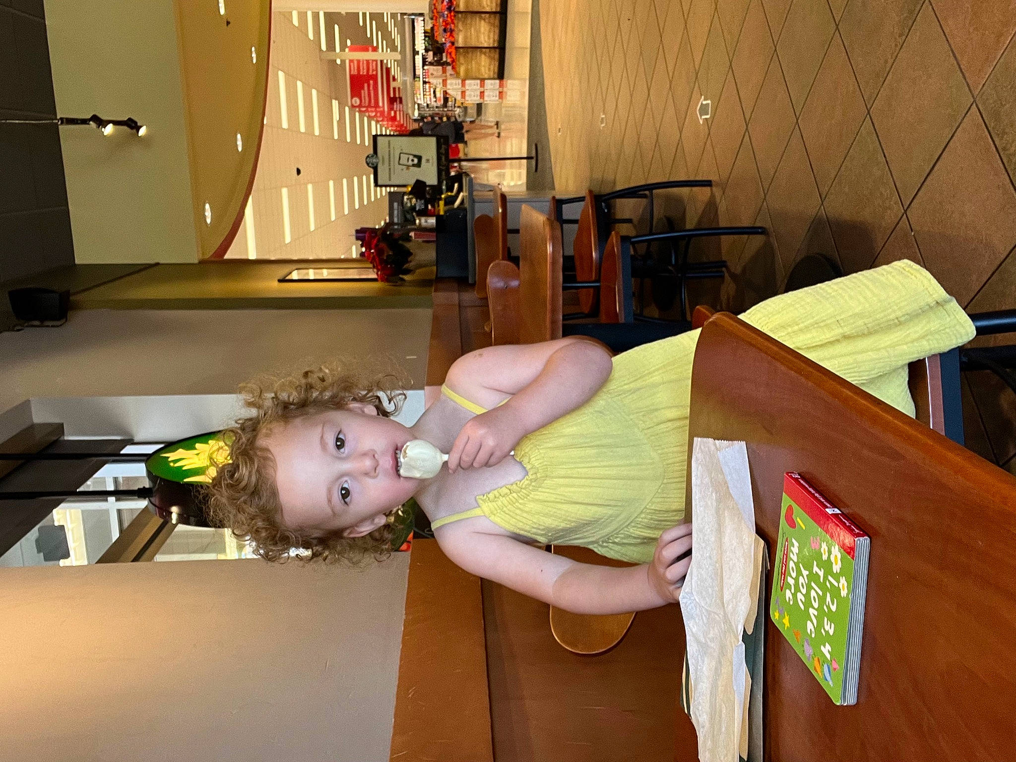 Zoe is registered to the contest to win money with this photo: abdomen, arm, baby_products, baby_toddler_clothing, child, comfort, elbow, flooring, fun, happy, hardwood, human_leg, leisure, person, room, table, toddler, vacation, wood