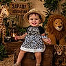 toddler, child, smiling, hat, dress, safari, plush_lion, plush_giraffe, plush_cheetah, wooden_chest, indoor, decor, plants, camera, lantern, happy, cute, portrait, playful, adventure