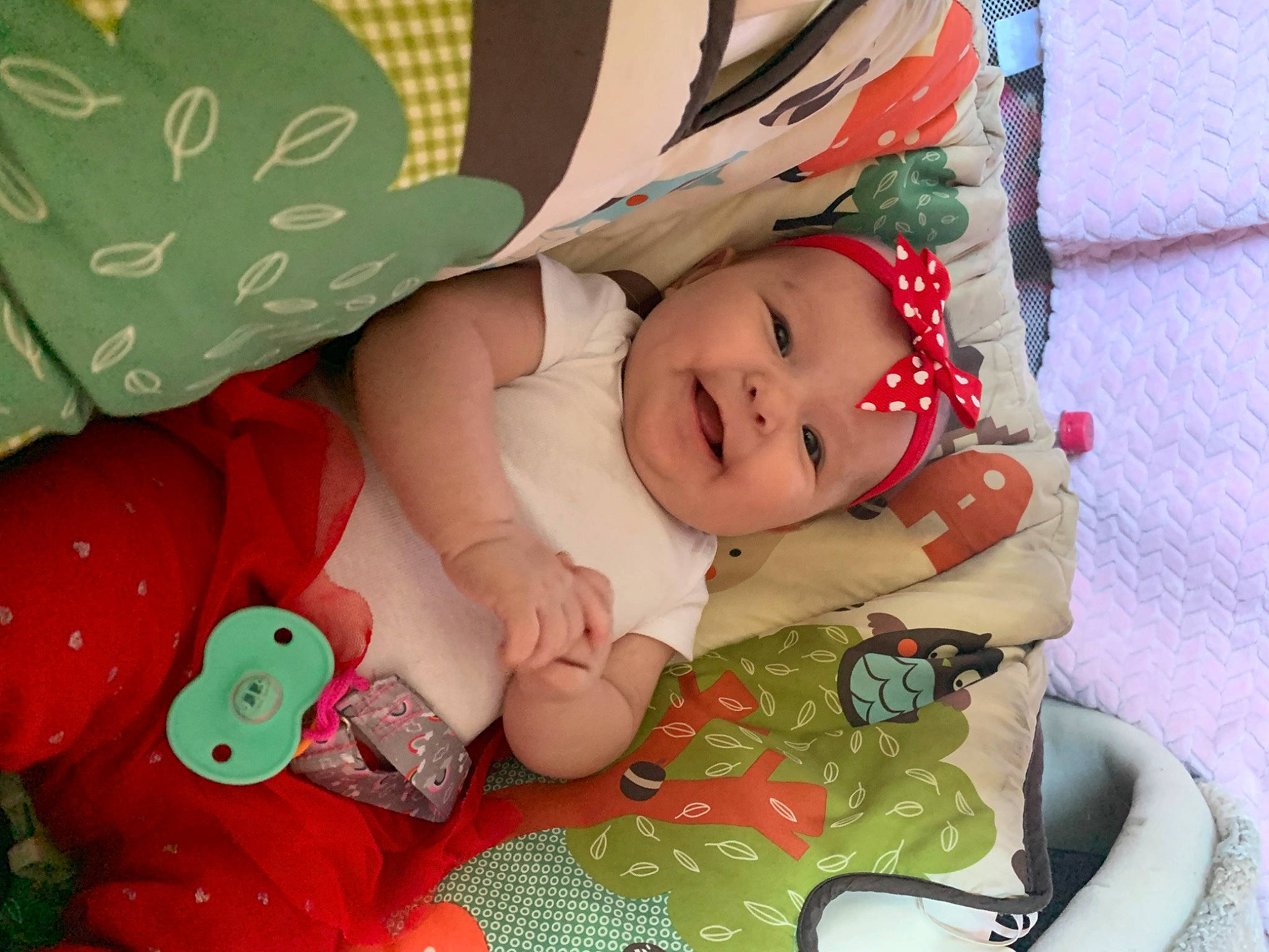 Katalina is registered to the contest to win money with this photo: baby, baby_products, baby_toddler_clothing, carmine, cheek, child, comfort, grass, green, headwear, linens, pattern, people, person, product, room, sitting, skin, sleeve, sock