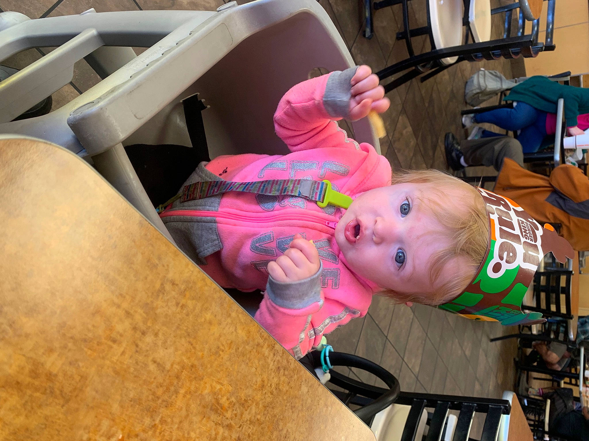 Harlee is registered to the contest to win money with this photo: auto_part, automotive_wheel_system, baby, baby_products, child, fun, hat, human_leg, leisure, machine, motor_vehicle, person, recreation, room, sitting, surprise, t_shirt, tire, toddler, vacation