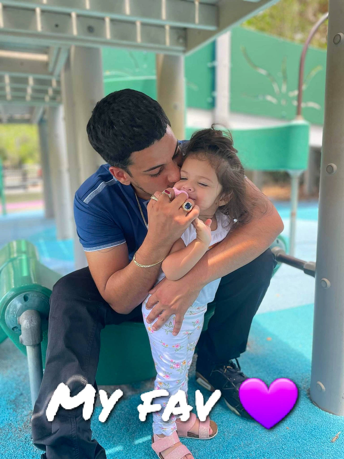 Annaleah is registered to the contest to win money with this photo: aqua, black_hair, child, entertainment, event, flash_photography, friendship, fun, gesture, grass, green, happy, hug, interaction, leisure, party, person, recreation, romance, sitting