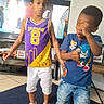 Jay'Ceon joined the competition — help win amazing prizes! child, boy, indoor, carpet, television, jeans, shirt, sneakers, sock, basketball_jersey, blue_shirt, playful, posing, living_room, furniture, floor_tile, home, casual_clothing, young, brothers