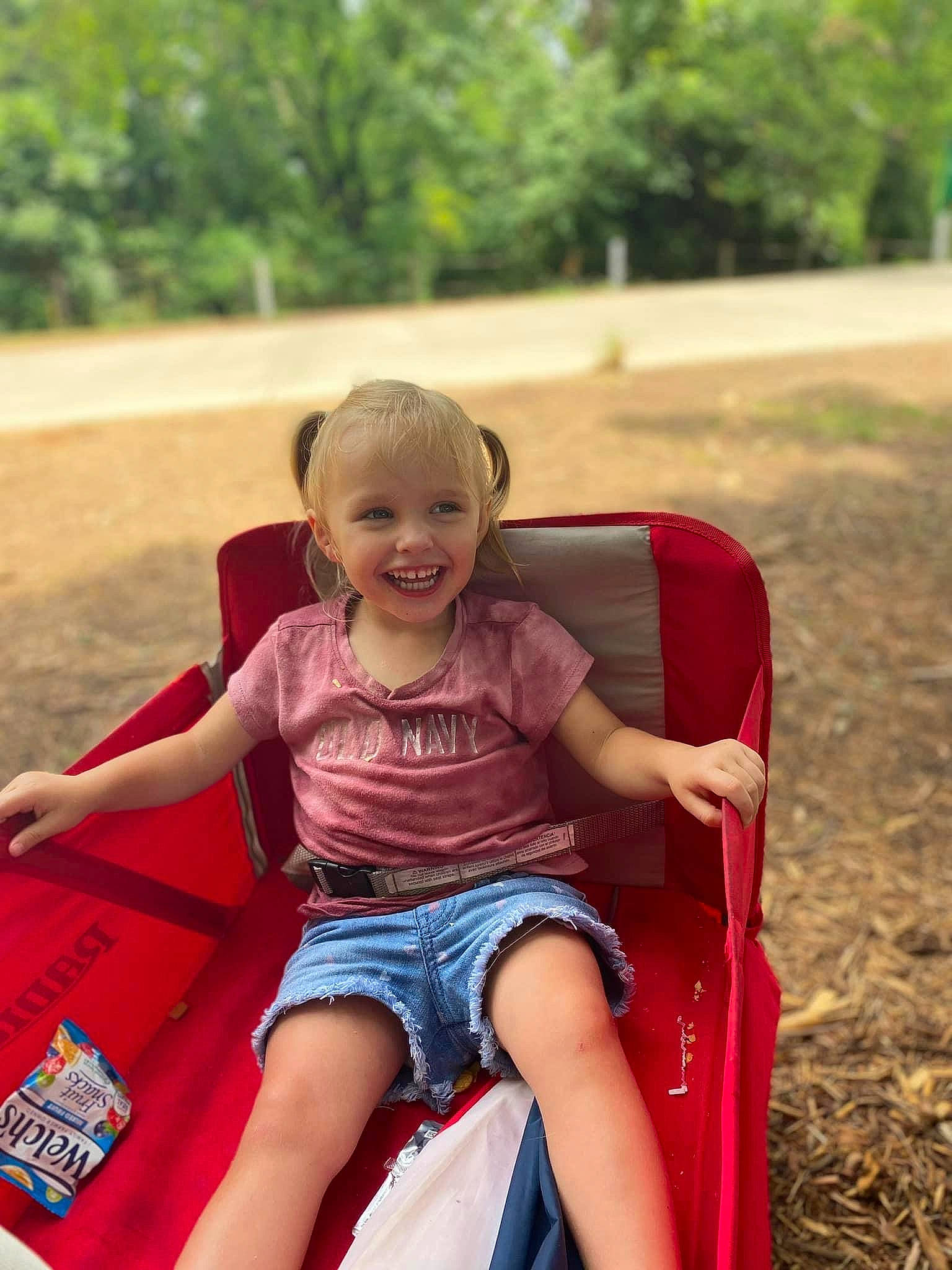Leti joined the competition — help win amazing prizes! child, fun, grass, happy, human_leg, joy, leisure, magenta, motor_vehicle, outdoor_play_equipment, people_in_nature, person, pink, recreation, sitting, skin, smile, summer, t_shirt, toddler