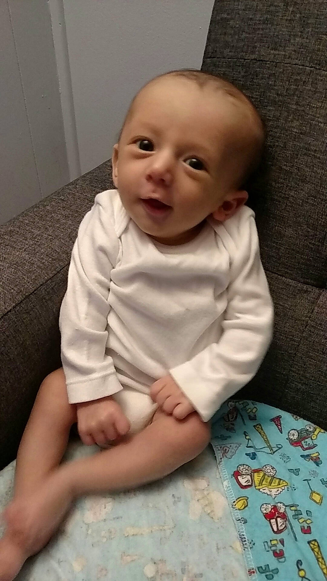 Apollo is registered to the contest to win money with this photo: cheek, child, day, eye, girl, head, infant, iris, leg, person, product, sitting, skin, smile, toddler