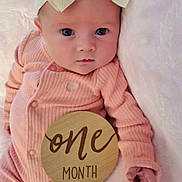 Ezlynn joined the competition — help win amazing prizes! baby, infant, one_month, headband, bow, pink_clothing, blanket, wooden_sign, portrait, cute, newborn, lying_down, soft_texture, child, baby_girl, hand, face, eyes, indoors, celebration