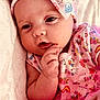 Ezlynn joined the competition — help win amazing prizes! baby, infant, child, pink_clothing, headband, cute, soft_texture, hand, face, portrait, lying_down, colorful, patterned_clothing, close_up, newborn, toddler, sleepy_eyes, baby_girl, soft_light, adorable