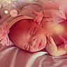 Evangeline joined the competition — help win amazing prizes! newborn, baby, sleeping, pink_headband, flower, tulle_skirt, soft_fabric, bokeh, portrait, infant, closeup, peaceful, cute, child, resting, skin, hand, head, bed, cozy