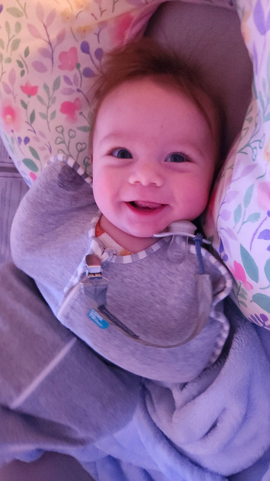 Cecil is registered to the contest to win money with this photo: baby, baby_toddler_clothing, cheek, comfort, eye, eyebrow, face, happy, head, iris, joy, linens, lip, magenta, person, pink, purple, skin, sleeve, smile