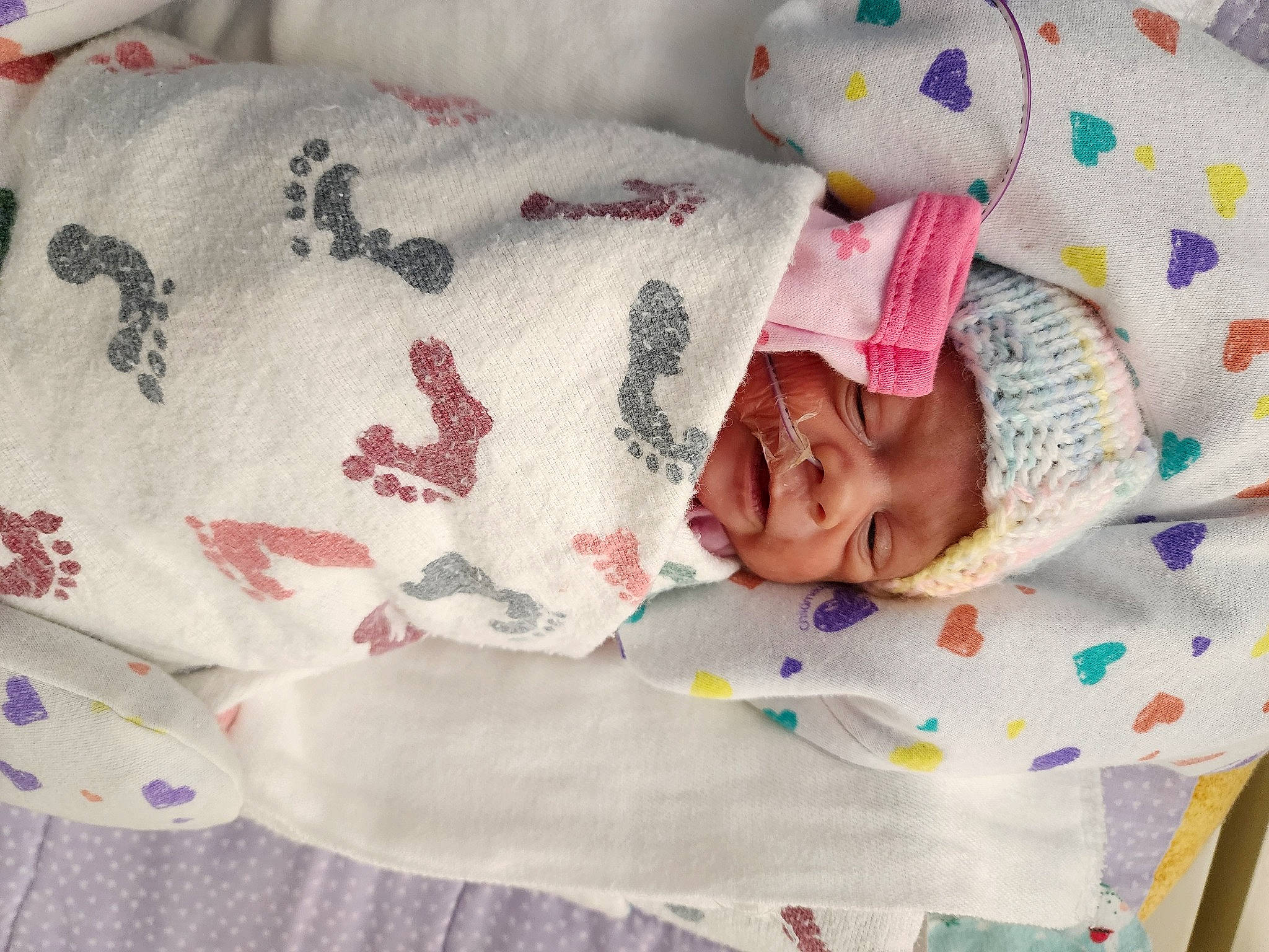 Daisy Rae Barber joined the competition — help win amazing prizes! baby, baby_products, baby_sleeping, baby_toddler_clothing, bed_sheet, bedding, bedtime, child, comfort, creative_arts, headwear, linens, pattern, person, pink, product, room, sleeve, smile, stuffed_toy