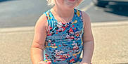 Eli joined the competition — help win amazing prizes! child, toddler, smiling, outdoor, sunlight, sidewalk, curb, clothing, mickey_mouse, colorful, shorts, sleeveless, blond_hair, happy, casual, summer, daytime, car, tree, person