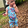 Eli is registered to the contest to win money with this photo: toddler, child, outdoor, blonde_hair, blue_clothing, mickey_mouse, shoes, curious, standing, nature, leaves, person, casual, young_child, summer_clothes, footwear, daylight, portrait, expression, cute