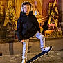Hugo participe au concours pour gagner de l'argent avec cette photo : child, boy, skateboard, headphones, glasses, jacket, jeans, sneakers, shop_window, night, urban, holiday_decor, advertisement, brand_nuxe, reflection, sidewalk, pose, smile, portrait, street