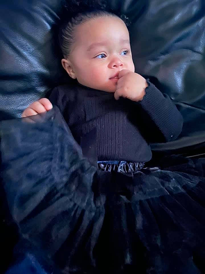 Stella Rose joined the competition — help win amazing prizes! baby, baby_toddler_clothing, child, comfort, couch, darkness, dress, flash_photography, formal_wear, grey, hairstyle, head, iris, outerwear, person, purple, sitting, skin, sleeve, textile