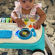 Nova joined the competition — help win amazing prizes! baby, carpet, child, closeup, colorful, cute, entertainment, floor, focus, hands, headband, indoor, infant, music_toy, person, play, striped_clothing, toy, walker, young
