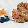 Sasha participe au concours pour gagner de l'argent avec cette photo : newborn, baby, sleeping, plush_toy, fox, white_hat, brown_outfit, winnie_the_pooh, soft_blanket, infant, cute, peaceful, child, toy, lying_down, cozy, portrait, indoors, sleep, small_hand
