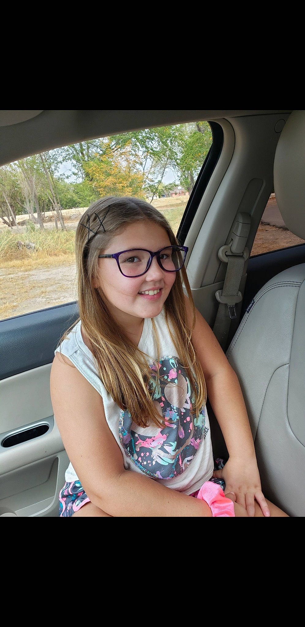 Ellyana joined the competition — help win amazing prizes! auto_part, automotive_exterior, car, car_seat, driving, eyewear, family_car, glasses, joy, long_hair, person, smile, vehicle, vehicle_door