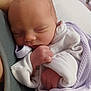 Summer is registered to the contest to win money with this photo: newborn, baby, sleeping, blanket, infant, soft, cute, wrapped, peaceful, hands, face, clothing, purple, white, skin, portrait, closeup, resting, child, person