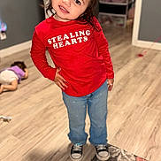 Emerson joined the competition — help win amazing prizes! child, red_shirt, jeans, sneakers, indoor, floor, rug, door, cabinet, playful, smile, pose, hair, face, person, wooden_floor, children, casual_clothing, home, background
