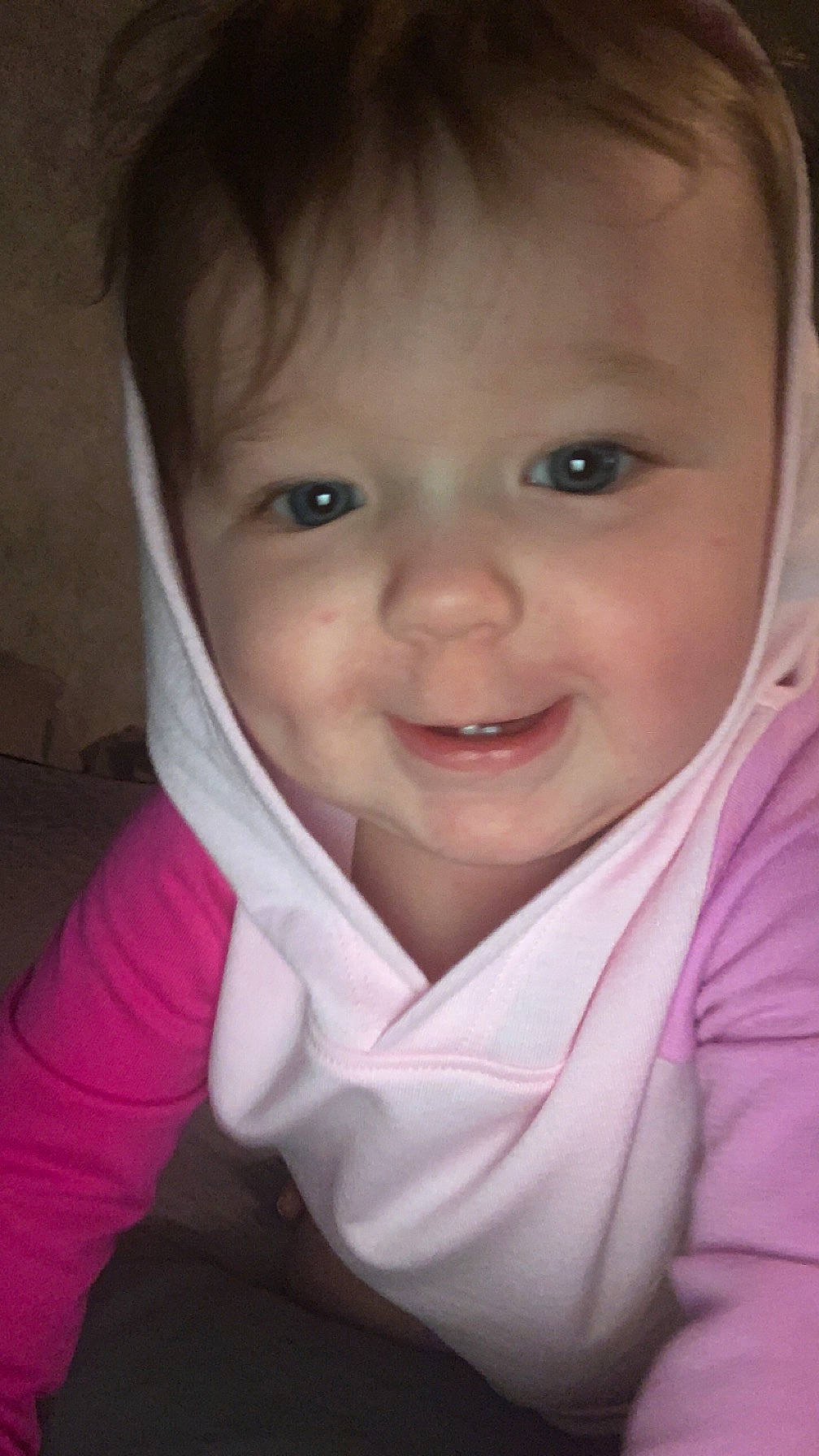 Lexie is registered to the contest to win money with this photo: baby, baby_products, baby_toddler_clothing, cheek, child, close_up, eyebrow, eyelash, fun, happy, iris, laugh, lip, nose, outerwear, person, pink, skin, sleeve, smile