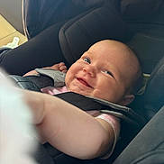 Emersyn is registered to the contest to win money with this photo: baby, car_seat, child, smile, happy, seatbelt, infant, person, safety, straps, cute, indoors, closeup, head, face, skin, clothing, arm, seat, baby_carrier