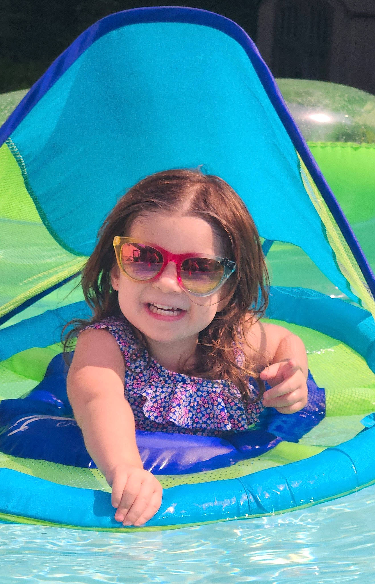 Presley is registered to the contest to win money with this photo: aqua, azure, beauty, blue, electric_blue, eyewear, fun, goggles, green, happy, joy, leisure, person, photograph, product, recreation, smile, summer, sunglasses, toddler