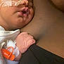 baby, sleeping, nasal_tube, hand, skin, person, closeup, medical, comfort, rest, infant, healthcare, tenderness, holding, hospital, care, clothing, bedroom, intimacy, parent