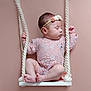 baby, infant, swing, rope, headband, flower, pink, lace, clothing, child, portrait, cute, peaceful, studio, indoors, feet, hands, face, sleepy, background