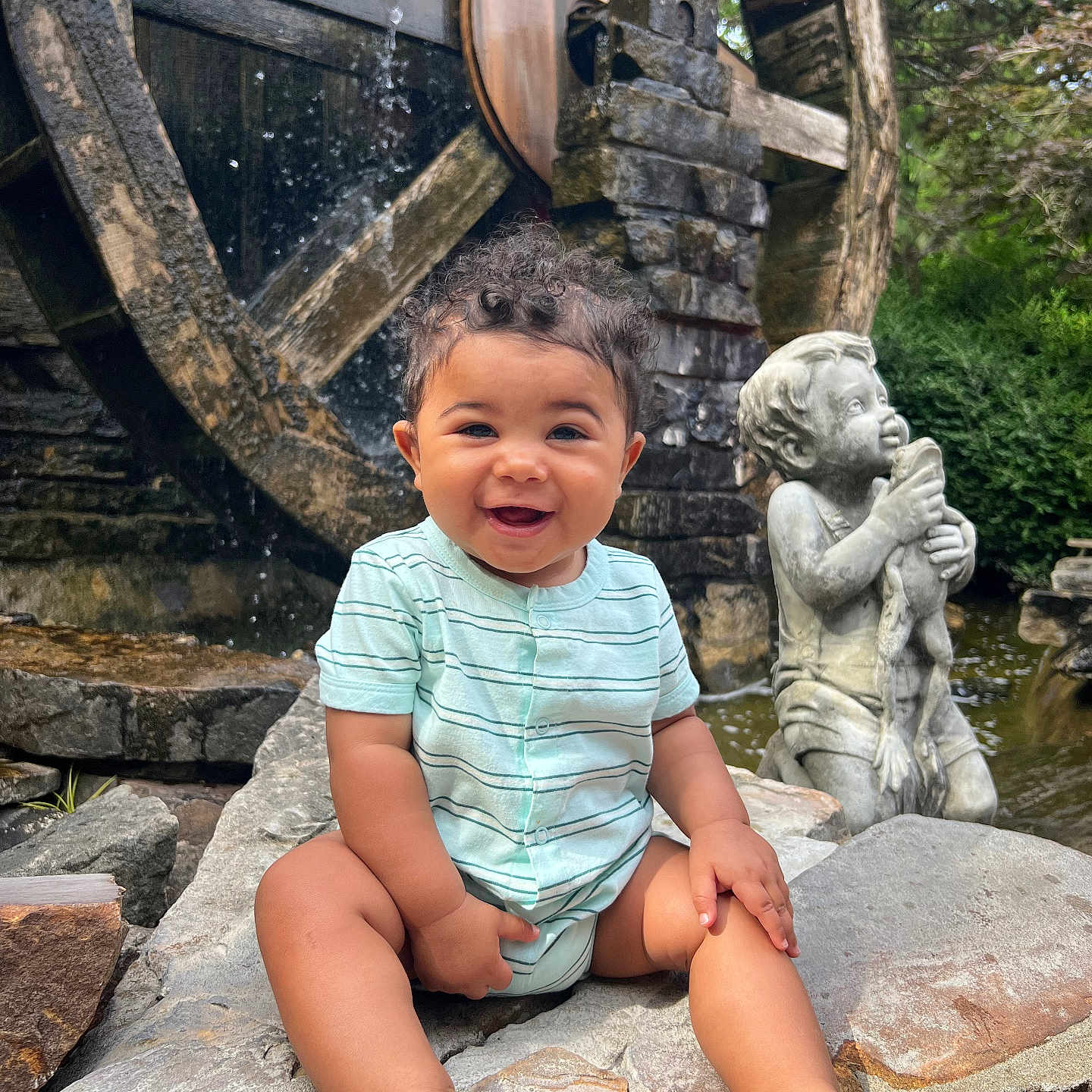 Khalan joined the competition — help win amazing prizes! boy, child, clothing, face, happy, head, male, nature, outdoors, person, photography, portrait, rock, shorts, sitting, slate, summer, water, waterfall, wood