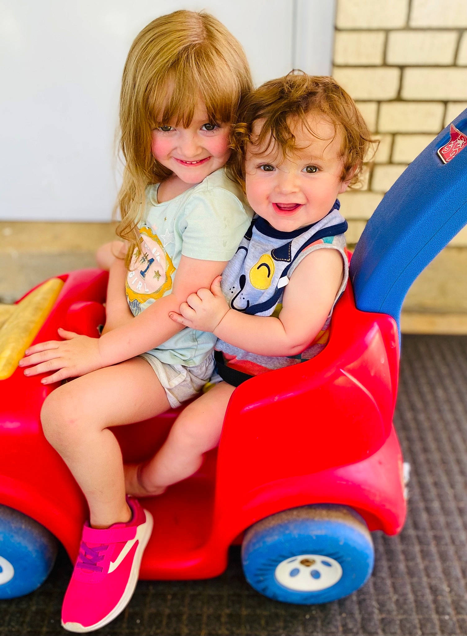 Jasper joined the competition — help win amazing prizes! baby_toddler_clothing, blue, dress, facial_expression, fun, happy, joy, organ, person, photograph, pink, product, red, riding_toy, skin, smile, tire, toddler, toy, vehicle