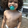 Jayden is registered to the contest to win money with this photo: child, toddler, curly_hair, pacifier, diaper, smiling, outdoor, bare_chest, young_child, playful, cute, person, happy, skin, face, head, baby, infant, childhood, daylight
