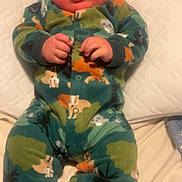 Mythiyus joined the competition — help win amazing prizes! baby, infant, pajamas, onesie, child, cute, face, hands, pillow, bed, blanket, sleepwear, indoor, cozy, expression, skin, head, footed_pajamas, pattern, sleep