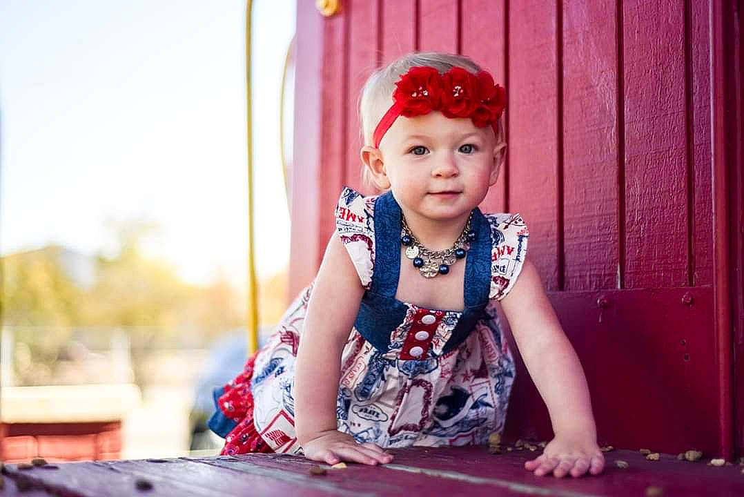 Shaylee joined the competition — help win amazing prizes! baby, beauty, child, child_model, hair_accessory, headpiece, headwear, person, photography, pink, sitting, skin, smile, toddler