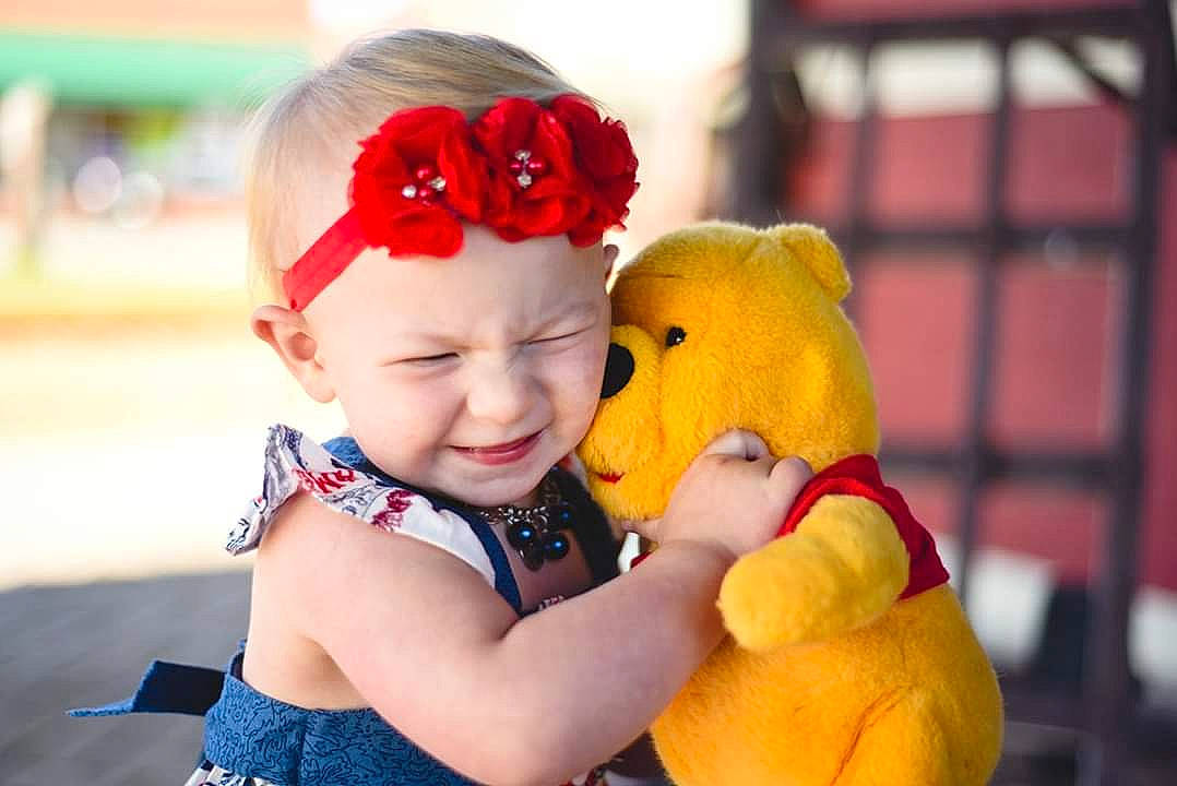 Shaylee is registered to the contest to win money with this photo: child, fun, happy, headgear, headwear, interaction, love, person, play, plush, smile, stuffed_toy, teddy_bear, toddler, toy, yellow