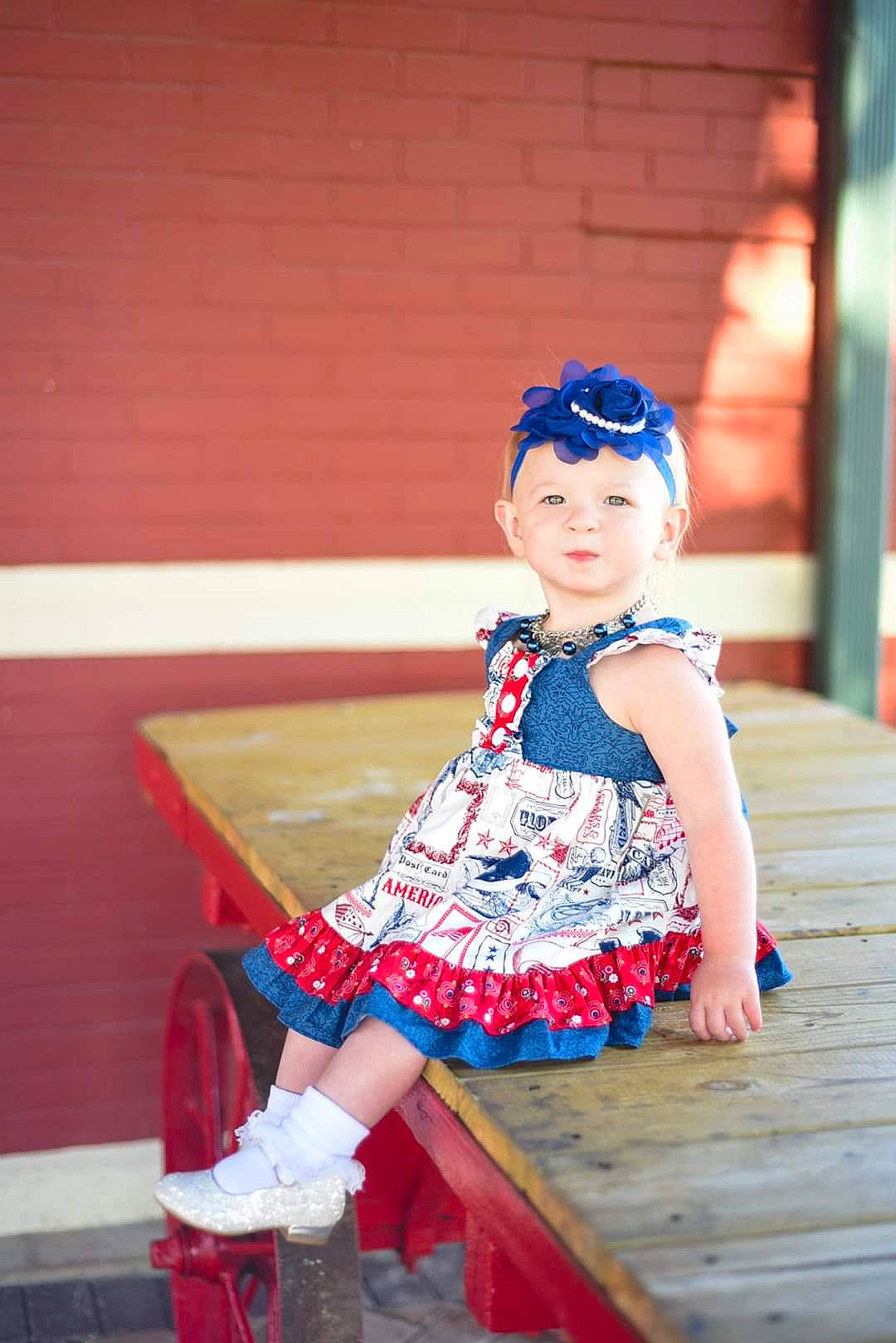 Shaylee joined the competition — help win amazing prizes! beauty, blue, child, child_model, costume, dress, fashion_accessory, hair_accessory, headgear, headwear, person, photograph, photography, red, sitting, snapshot, textile, toddler