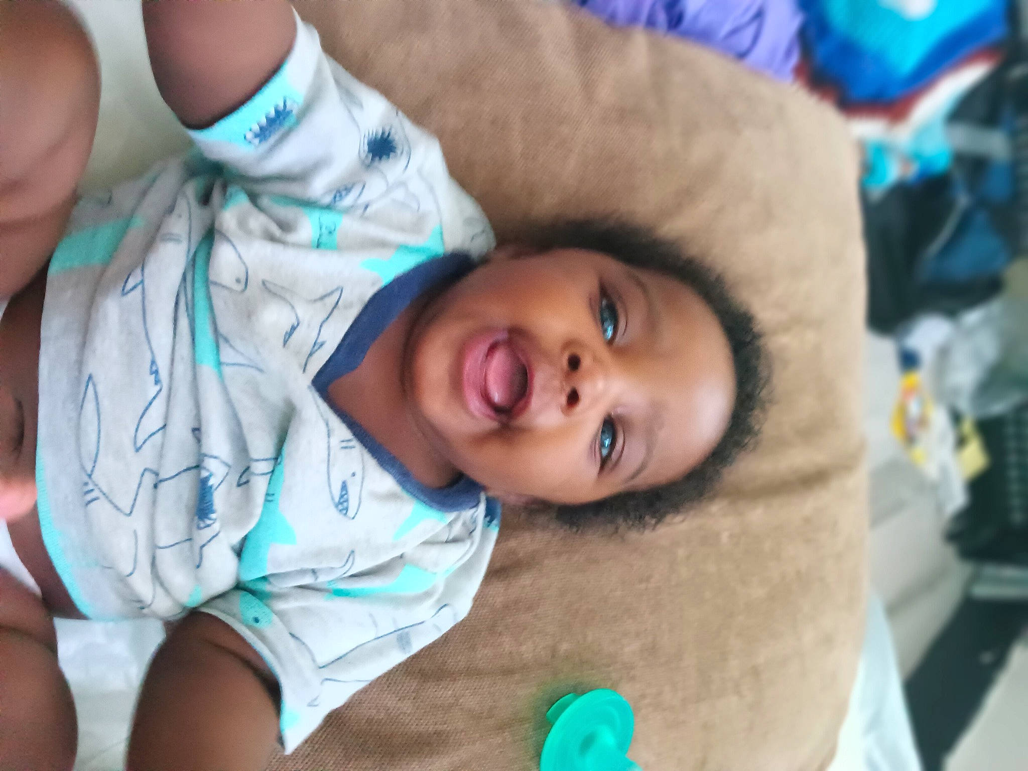 Tajmah is registered to the contest to win money with this photo: baby, blue, cheek, chest, child, comfort, elbow, eye, finger, fun, gesture, happy, human_body, iris, mouth, nose, person, skin, smile, toddler