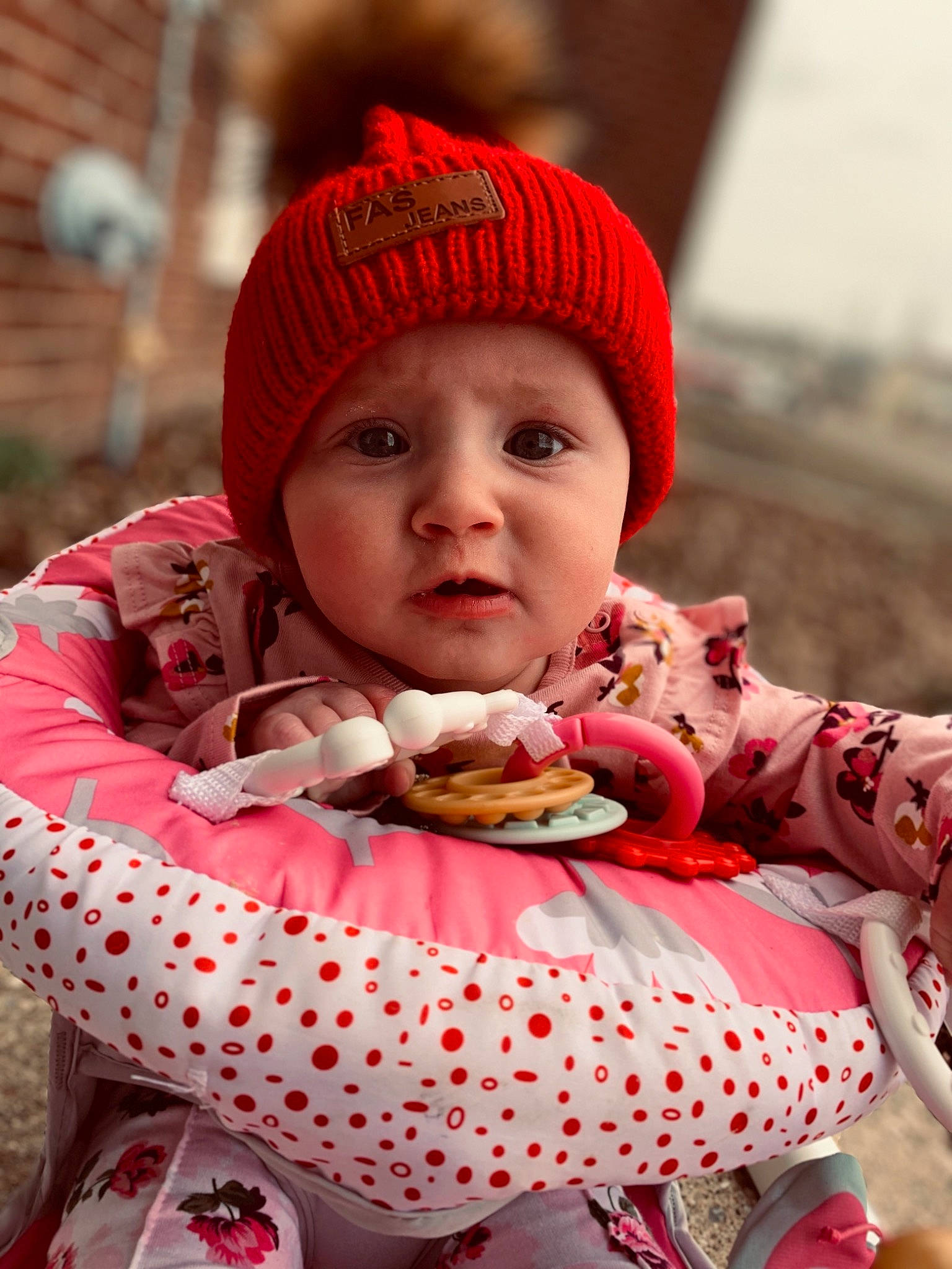 Evelynn joined the competition — help win amazing prizes! baby, baby_toddler_clothing, beanie, cap, child, face, fashion_accessory, food, happy, headwear, knit_cap, lip, pattern, person, pink, red, sitting, skin, sleeve, sweetness
