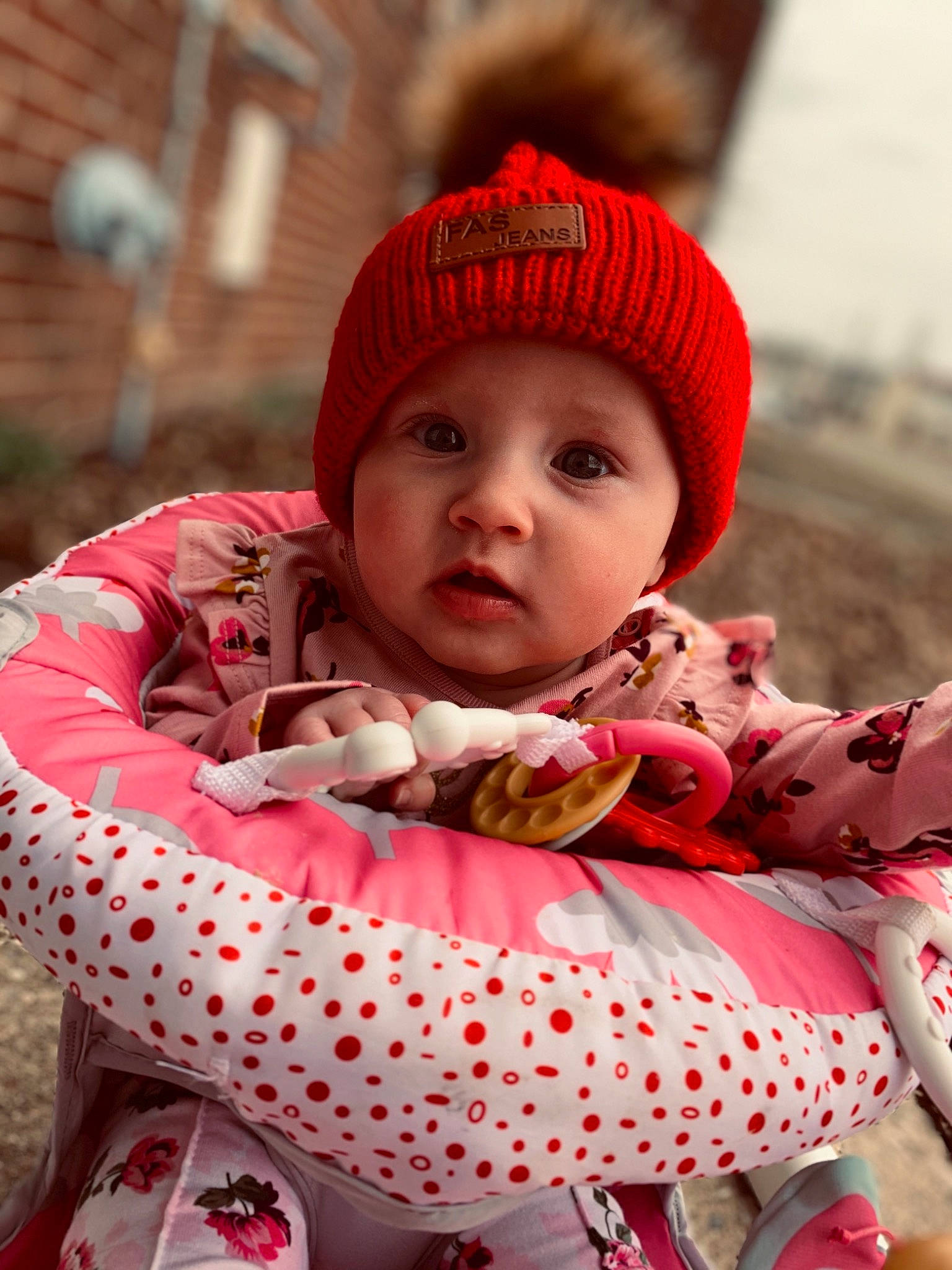 Evelynn joined the competition — help win amazing prizes! baby, baby_toddler_clothing, cap, cheek, child, chin, comfort, eye, face, happy, head, headwear, human_body, lip, pattern, person, pink, red, skin, sleeve