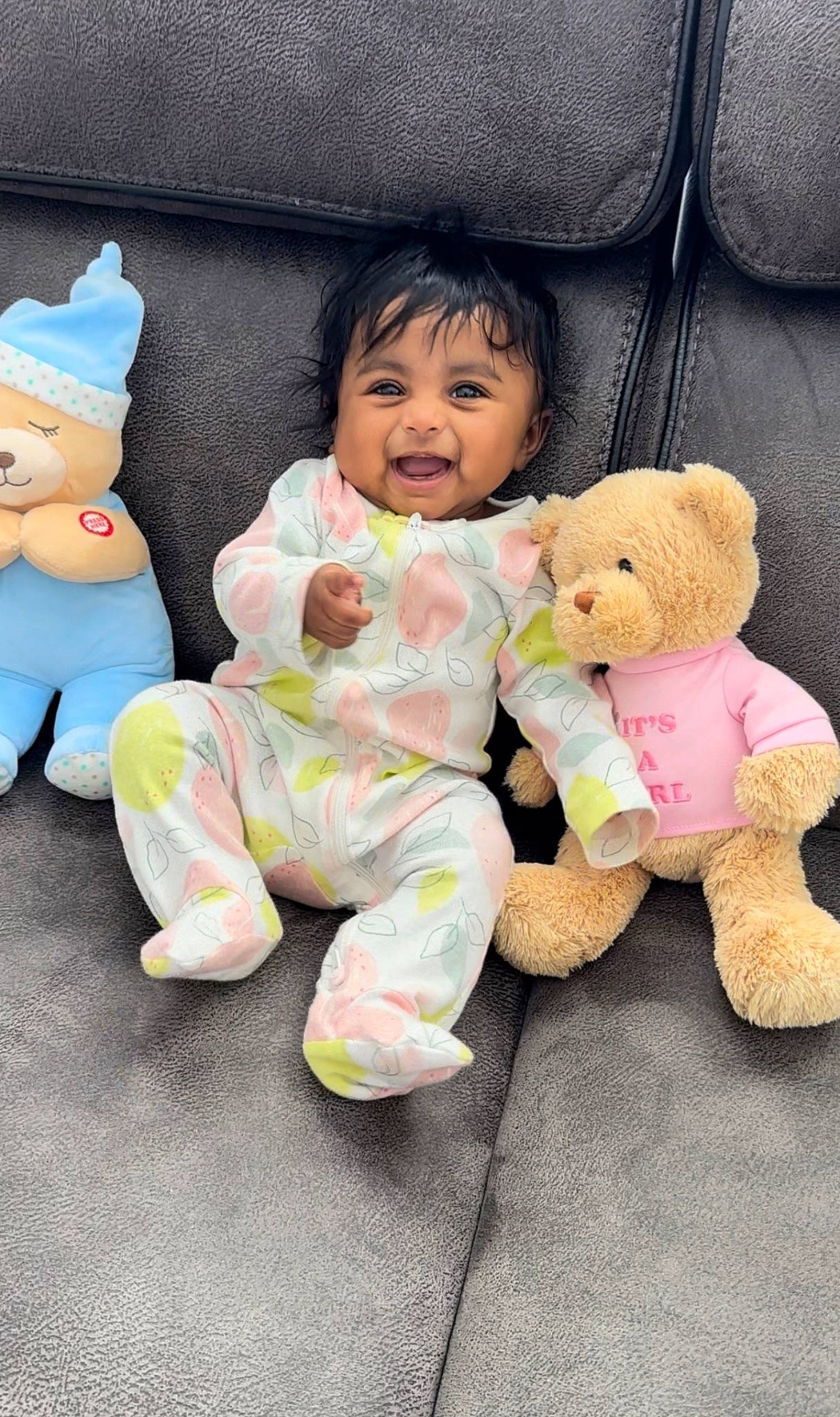 Ira is registered to the contest to win money with this photo: baby, baby_toddler_clothing, cheek, child, comfort, finger, gesture, happy, head, mammal, person, pink, plush, sitting, skin, sleeve, stuffed_toy, textile, toddler, toy